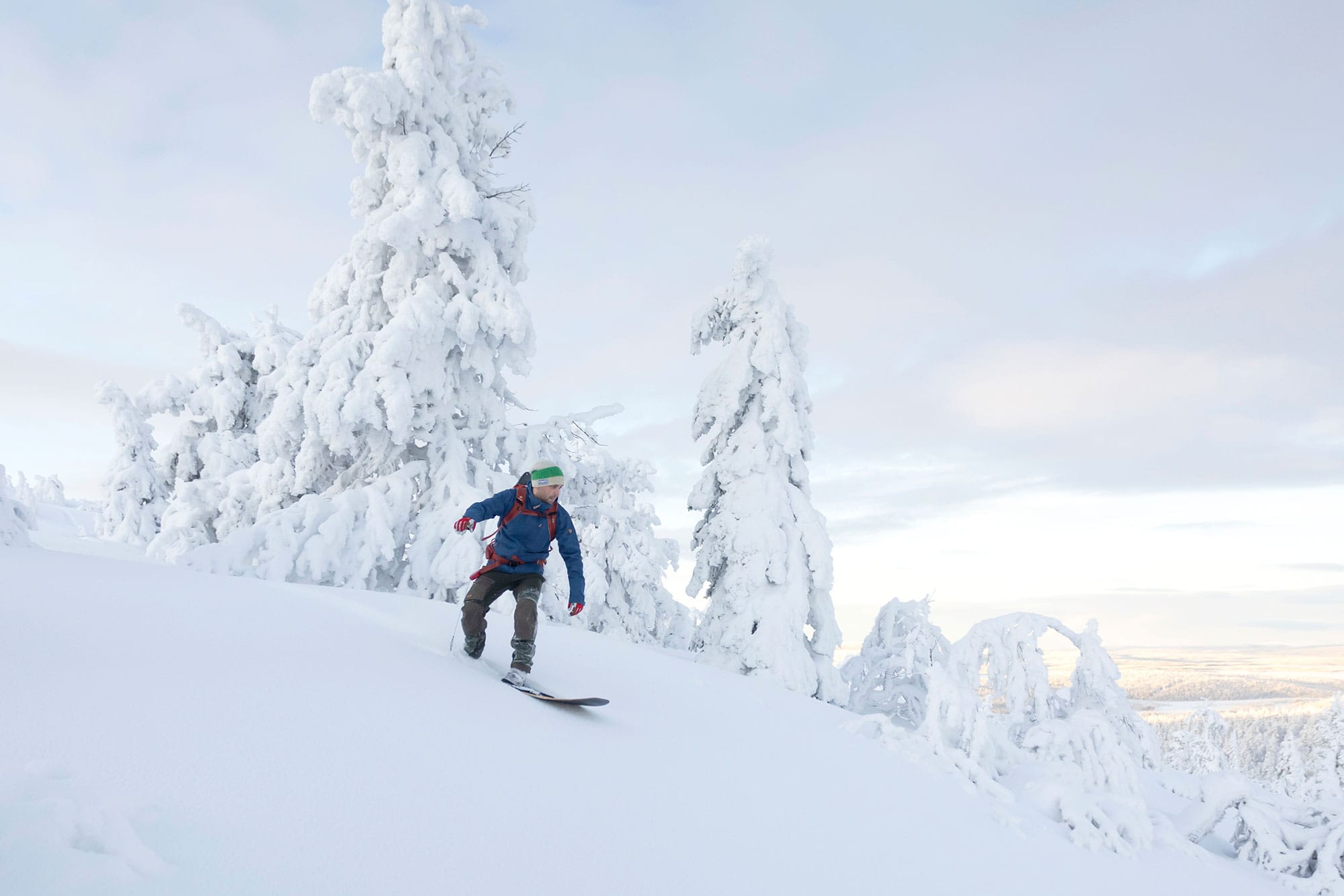 One snow surfer riding a frozen wave in Ylläs-Pallas National Park